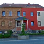 Pose d'une isolation thermique par l'extÃ©rieur sur la faÃ§ade d'une maison ancienne